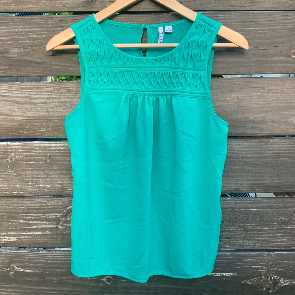 Green blouse with decorative neckline